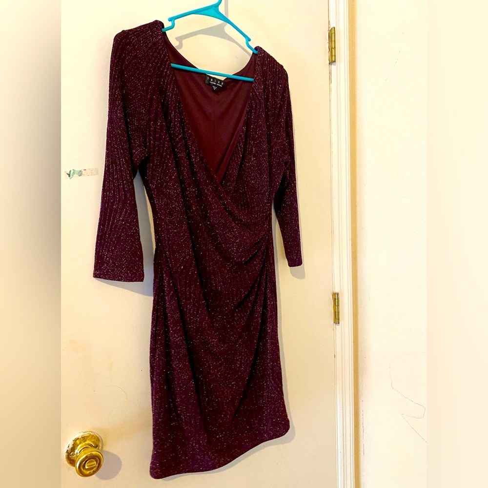 Short, fitted mid sleeve front cross over low cut party dress